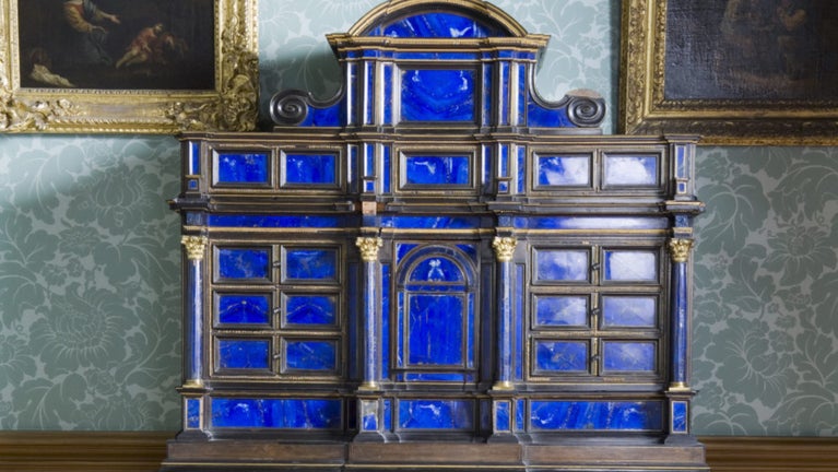 A late seventeenth century Italian, Florentine, lapis lazuli cabinet on a Charles II giltwood stand in the Dressing Room at Belton House, Lincolnshire,